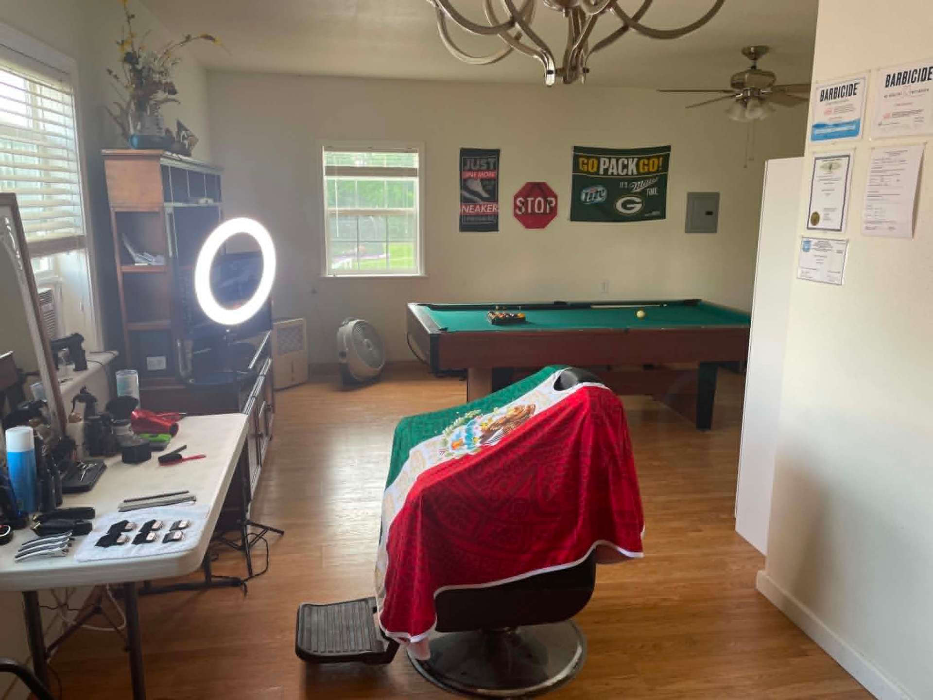 Interior of Sevenfold Barbershop — the barber chair, tools, and pool table